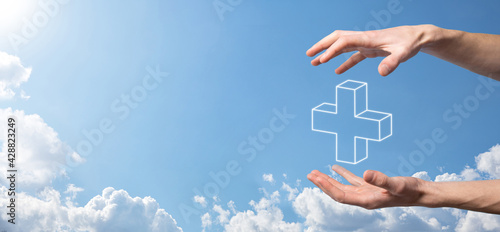 Hand hold 3D plus icon, man hold in hand offer positive thing such as profit, benefits, development, CSR represented by plus sign.The hand shows the plus sign