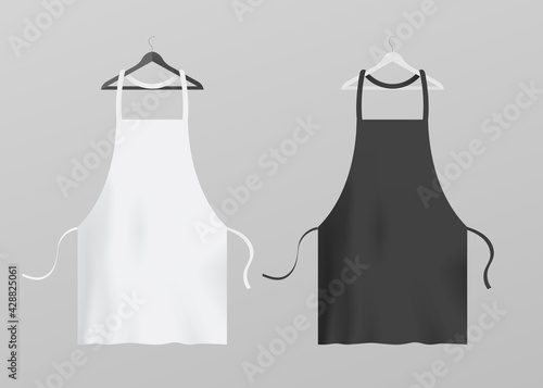 Two kitchen aprons hanging on hangers, realistic vector illustration isolated.