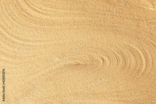 Abstract beach sand texture holiday seaside background in earth tones