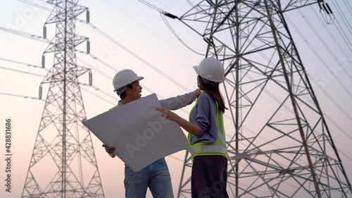 specialist electrical engineer working near to High voltage tower.