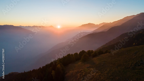 Valtellina, Italy, autumn sunset aerial view