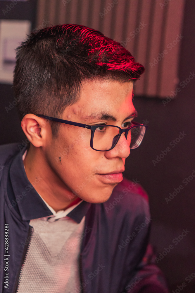 Fototapeta premium Young man concentrated on different activities.