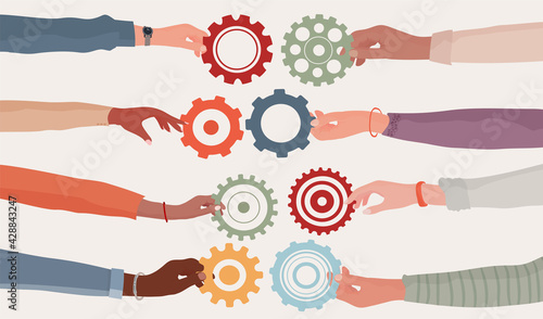 Cooperation teamwork and collaboration concept. Hands holding a gear that connects to another cogwheel Communication between diverse people. Diversity businesspeople. Community. Working