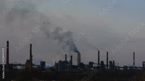 Wallpaper Mural Silhouettes of an industrial factory time lapse. Fuming chimneys. Air pollution concept background. Torontodigital.ca