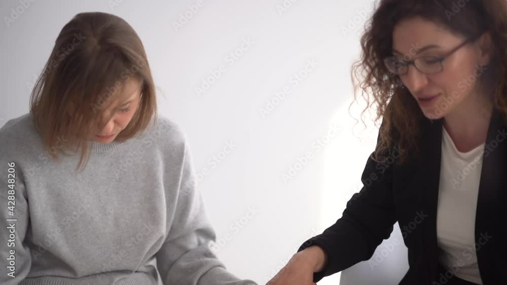 Close up women holding each others hands during group therapy, psychotherapy concept. Womens support circle Close up women holding each others hands during group therapy, psychotherapy concept. Womens support circle
