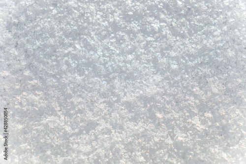 White melted snow close-up as a background.