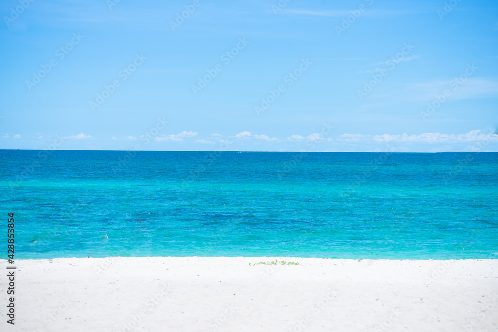 Beautiful wide of seascape with blue sky at daylight. Sand of beach smooth Sea. Beautiful wide of seascape with blue sky at daylight. Sand of beach smooth Sea.