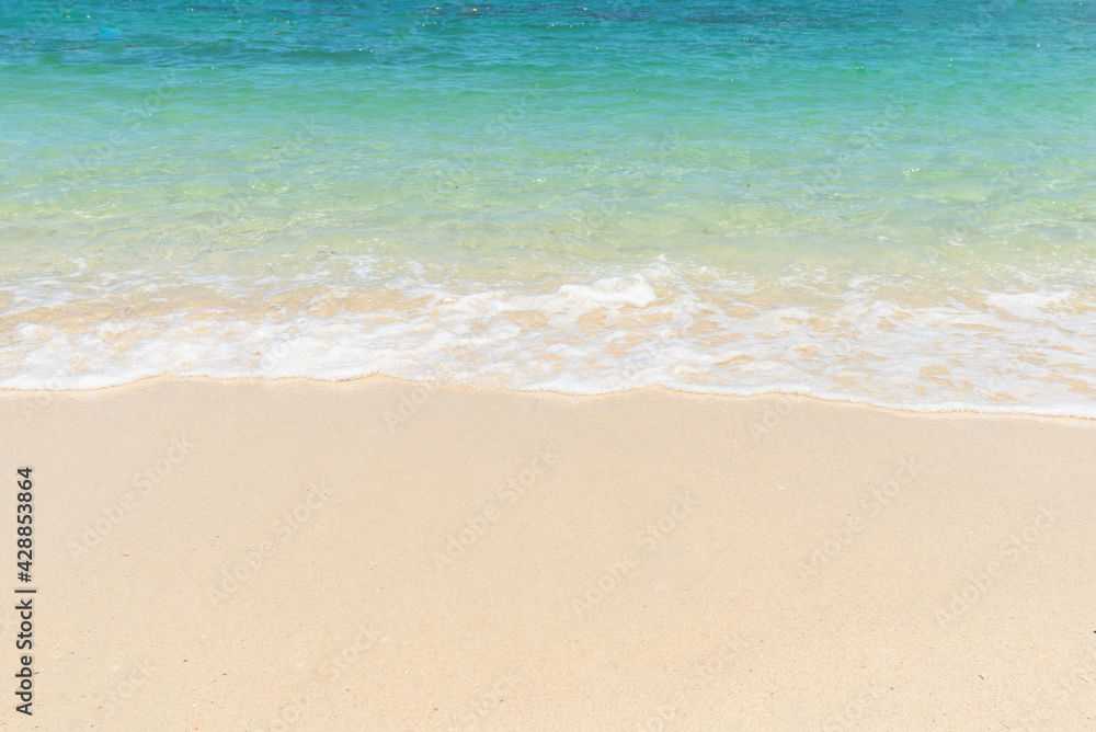 Beautiful clear sand beach and tropical light blue sea. Soft wave of blue ocean on sandy beach. Sallow water, Clear water. Seaside. Beautiful clear sand beach and tropical light blue sea. Soft wave of blue ocean on sandy beach. Sallow water, Clear water. Seaside.