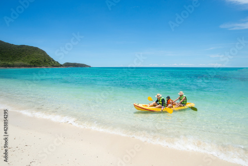 28 Jun 2019 : Chonburi Thailand. Family playing Kayak or canoeing in the sea. Family People traveler kayaking in the ocean. Holiday and outdoor concept. Fresh water. Family time concept. Copy Space.