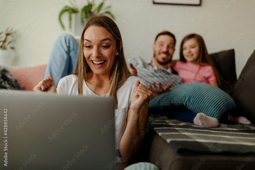 A young married couple with a child is enjoying the house. A young married couple with a child is enjoying the house.