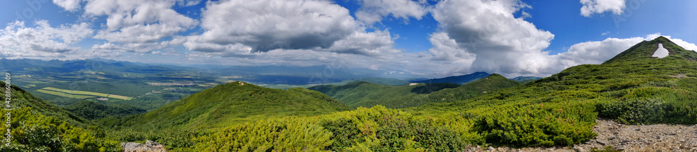 Kamchatka Mountains. Mountains covered with grass. The volcanic ring. Kamchatka Mountains. Mountains covered with grass. The volcanic ring.