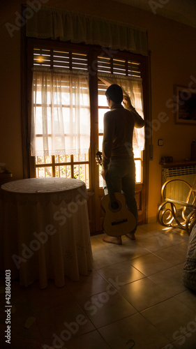 Man eager to go out on the street to play the Spanish guitar