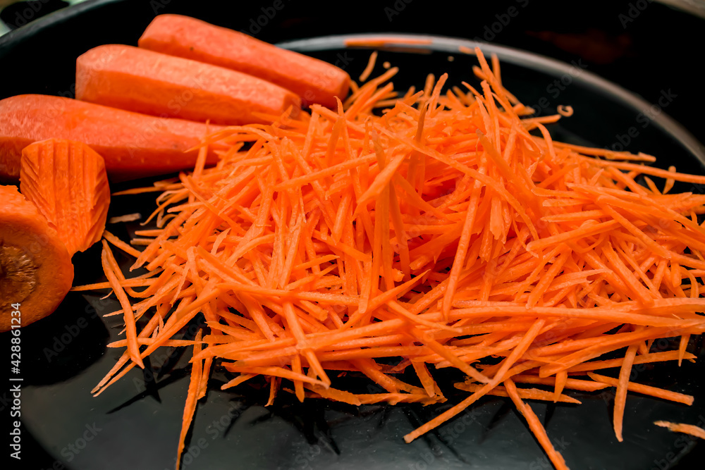 Chopped carrots on a platter on the table Chopped carrots on a platter on the table