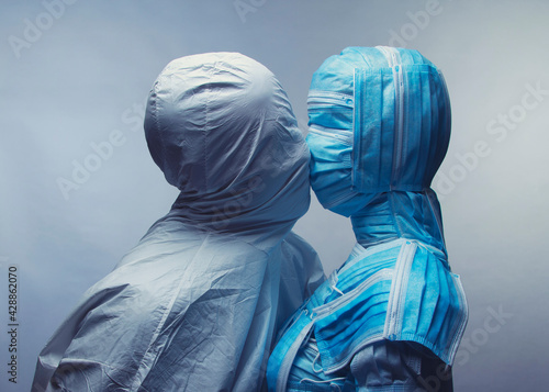 Man and Woman in medical  protection.  Surreal concept art.