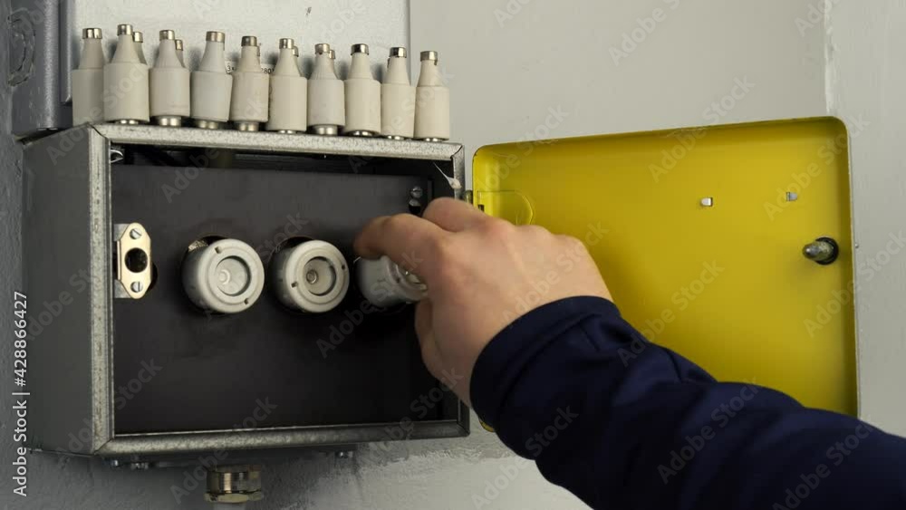 Change a fuse in old fuse box. A metallic with three older