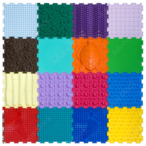 Square multicolored rubber mat on a white background, top view of the isolated