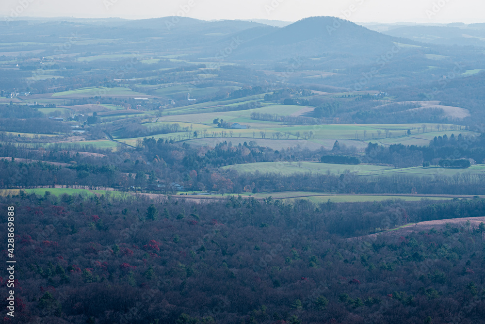 mountains and trees in a hazy autumn landscape mountains and trees in a hazy autumn landscape