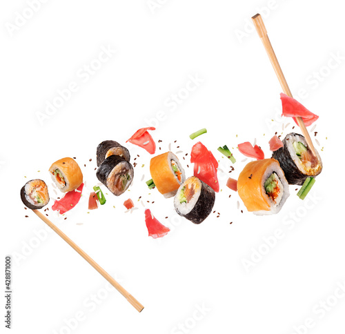 Fresh sushi rolls with ingredients in the air, isolated on white background