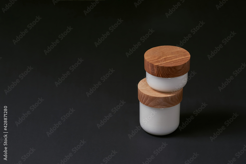 Round bottles with cosmetological cream stacked Round bottles with cosmetological cream stacked