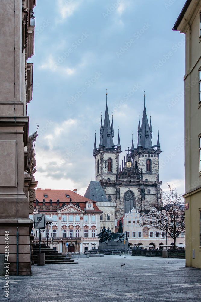 Fototapeta premium Morning postcard view of empty Old Town Square with Church of Our Lady, Tyn Church,Prague, Czech Republic. Beautiful city centre without people.Famous unesco heritage place.Picturesque urban scene