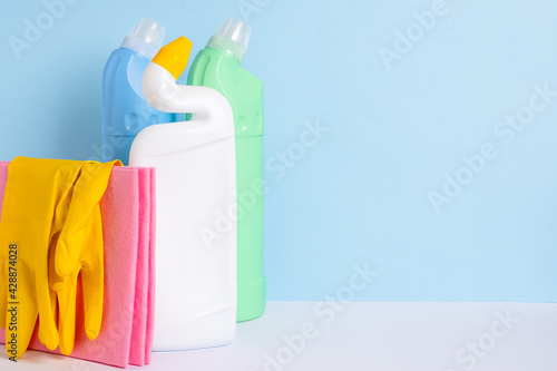 Cleaning products for daily use in the home on blue background. The concept of cleaning the service.High quality photo