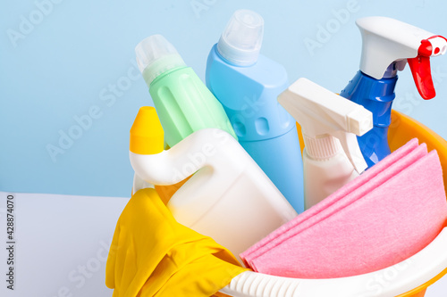 Cleaning supplies isolated on blue background. Cleaning accessories. Isolate. Top view. Close up.