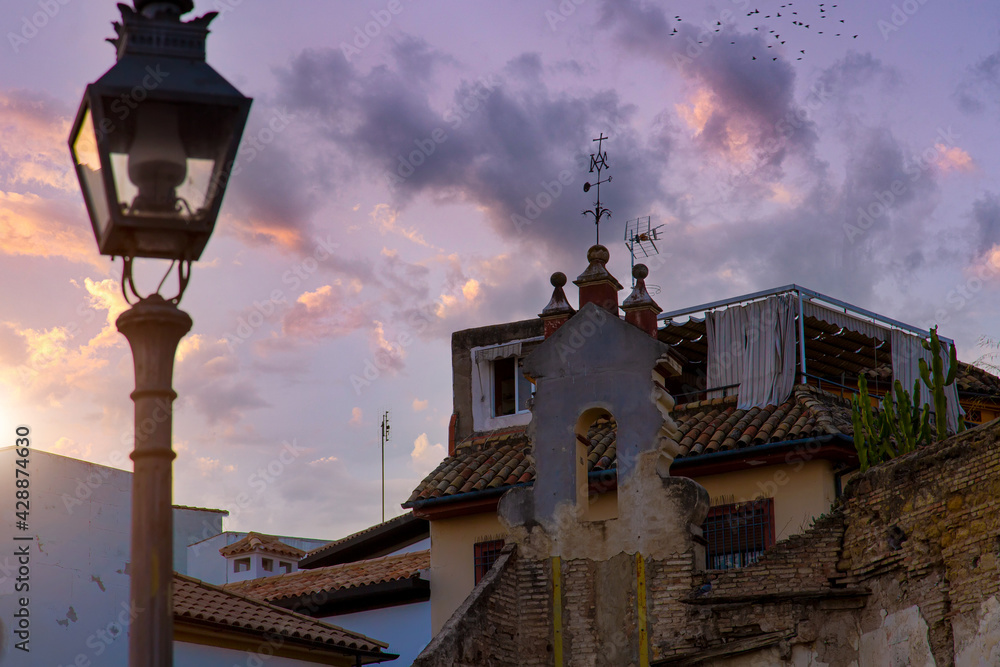 Cordoba streets at sunset in historic city center near Mezquita Cathedral.