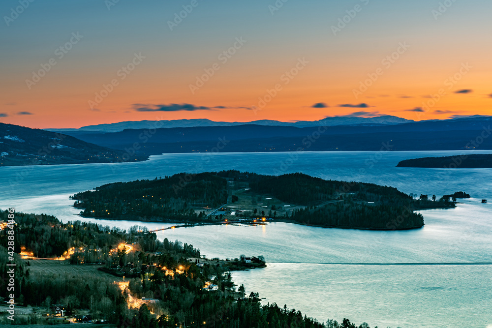 Sunset over Steinsfjorden, a branch of Lake Tyrifjorden located in Buskerud, Norway. View from Kongens Utsikt (Royal View) at Krokkleiva, Viken fylke.