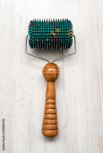 Medical needle roller. Acupuncture massage roller with micro needles to improve blood circulation. Medical applicator, alternative medicine device