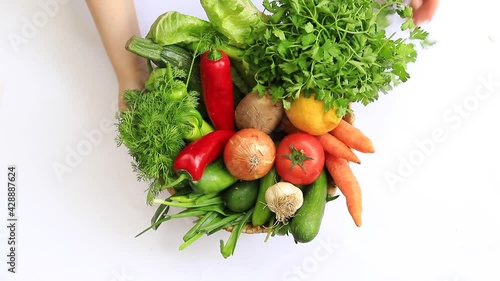  Fresh Vegetables in basket on white isolated background.