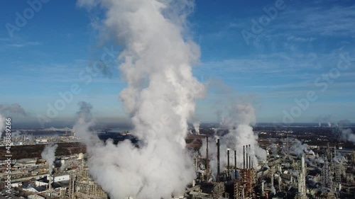 2020 - good aerial over a huge oil refinery along the Mississippi River in Louisiana suggests industry, industrial, pollution.  photo