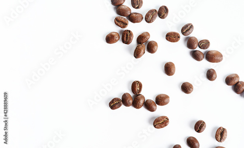 Brown roast, Dark aromatic roasts beans coffee on white background with copyspace.