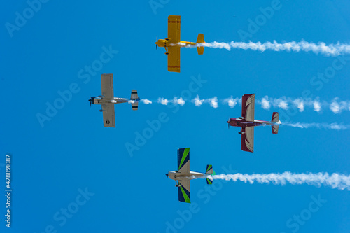 airplanes flyby at air show with smoke trails