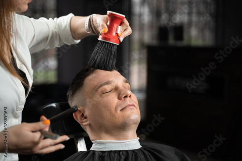 Barbershop service. Cutting hair. Hairstyle for handsome man. photo