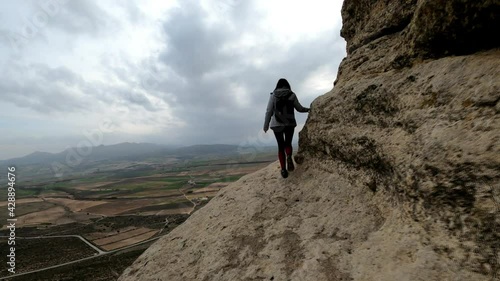 Woman hiking, walking at Cuevas de Zaen 