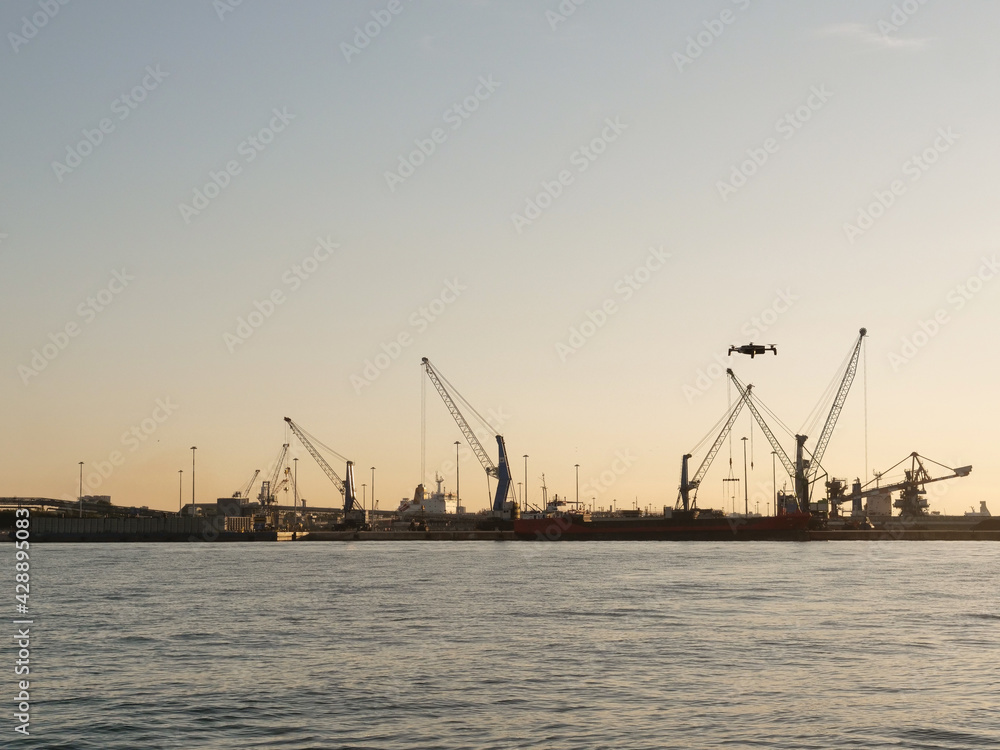 industrial port with ship and  heavy duty crane   brindisi. 