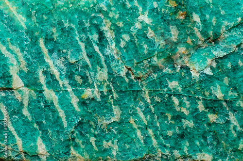 Abstract background. Rough surface of natural amazonite photo