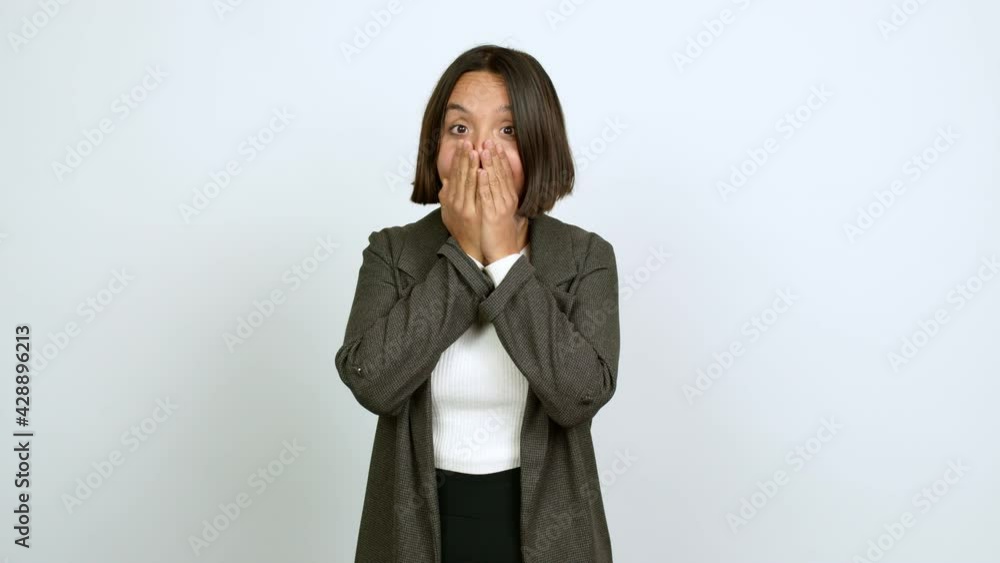Young latin woman covering mouth with hands. Can not speak over isolated background Young latin woman covering mouth with hands. Can not speak over isolated background