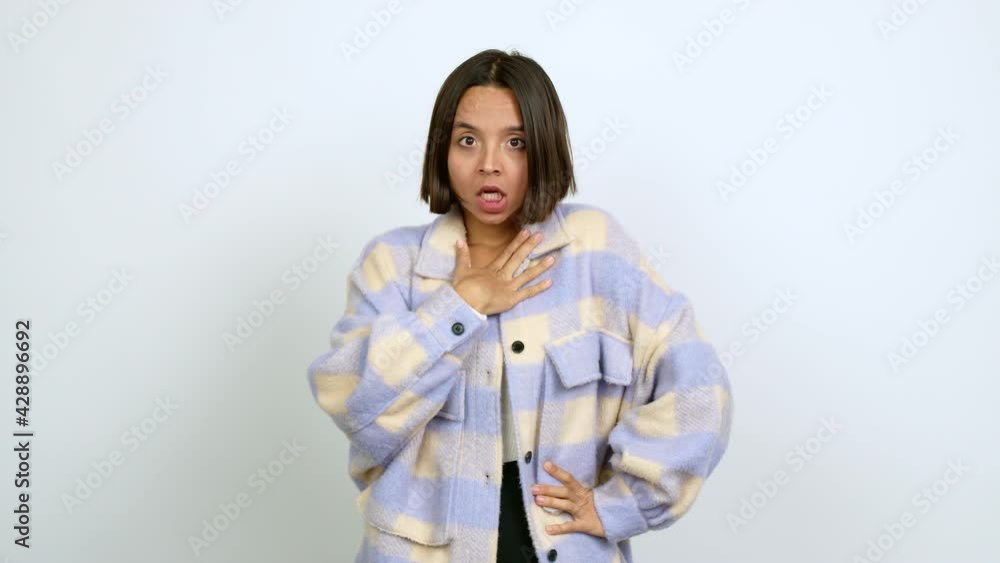 Young latin woman gaping because have just surprised with a gift over isolated background Young latin woman gaping because have just surprised with a gift over isolated background