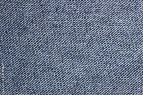 Close-up blue denim texture. Blue jeans texture for background. Texture of blue jeans as background, close up