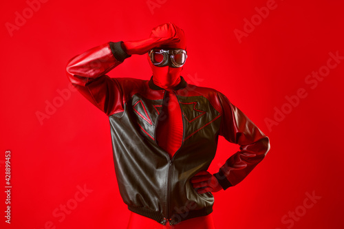 A funny super hero in a red leotard and protective glasses © Ulia Koltyrina