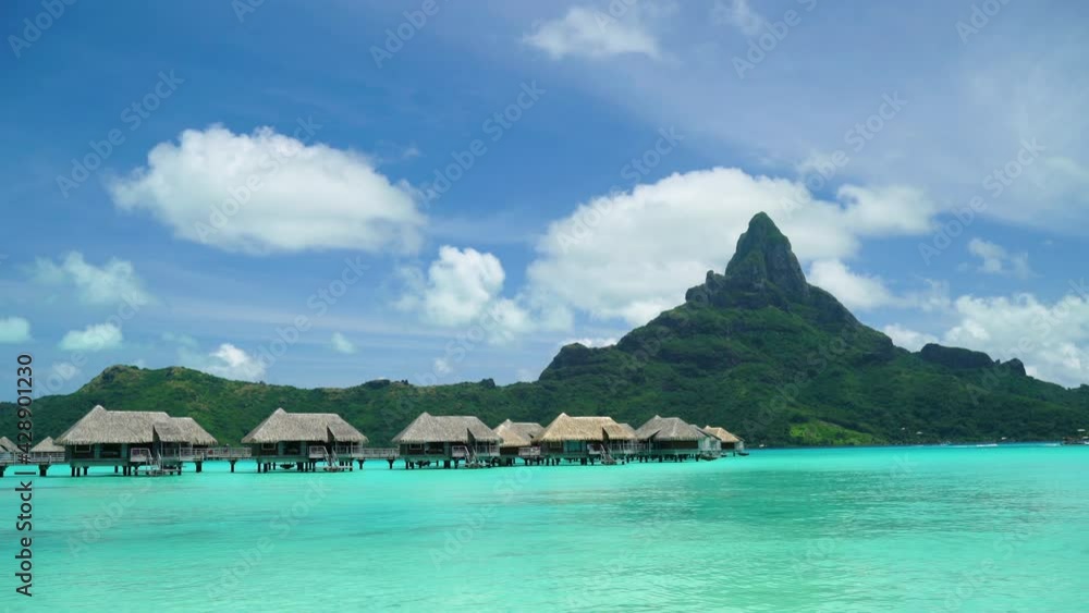 Bora Bora vacation paradise island with overwater bungalows resort hotel in coral reef lagoon ocean and beach. Mount Otemanu in background, Bora Bora, French Polynesia, Tahiti, South Pacific Ocean Bora Bora vacation paradise island with overwater bungalows resort hotel in coral reef lagoon ocean and beach. Mount Otemanu in background, Bora Bora, French Polynesia, Tahiti, South Pacific Ocean