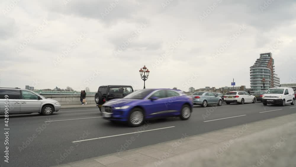 Busy street on a bridge in an urban environment Busy street on a bridge in an urban environment