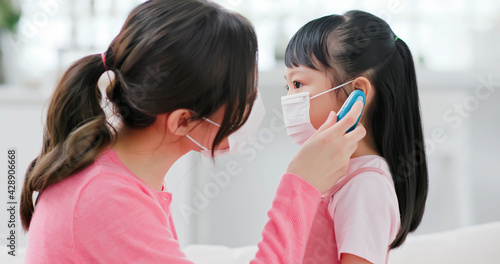 Mom use ear thermometer photo