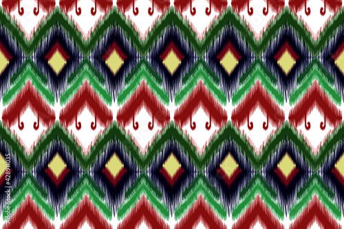 Ikat ethnic seamless pattern design. Carpet boho Aztec fabric batik African Indian American chevron textile wallpaper. 