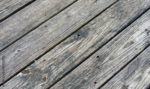 Gray weathered boards on a dock.