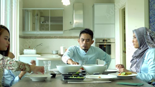 Eid Mubarak celebration moment, Malay family having dinner