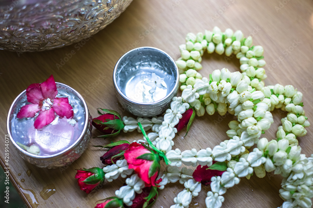 Close-up background Of Buddha images and flowers for ceremonies on auspicious days (New Year, Songkran Festival) Close-up background Of Buddha images and flowers for ceremonies on auspicious days (New Year, Songkran Festival)