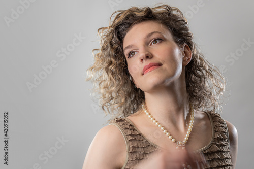 Candid Retro Caucasian Girl wearing pearl necklace