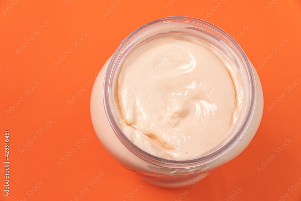 Mayonnaise can on the orange background Mayonnaise can on the orange background